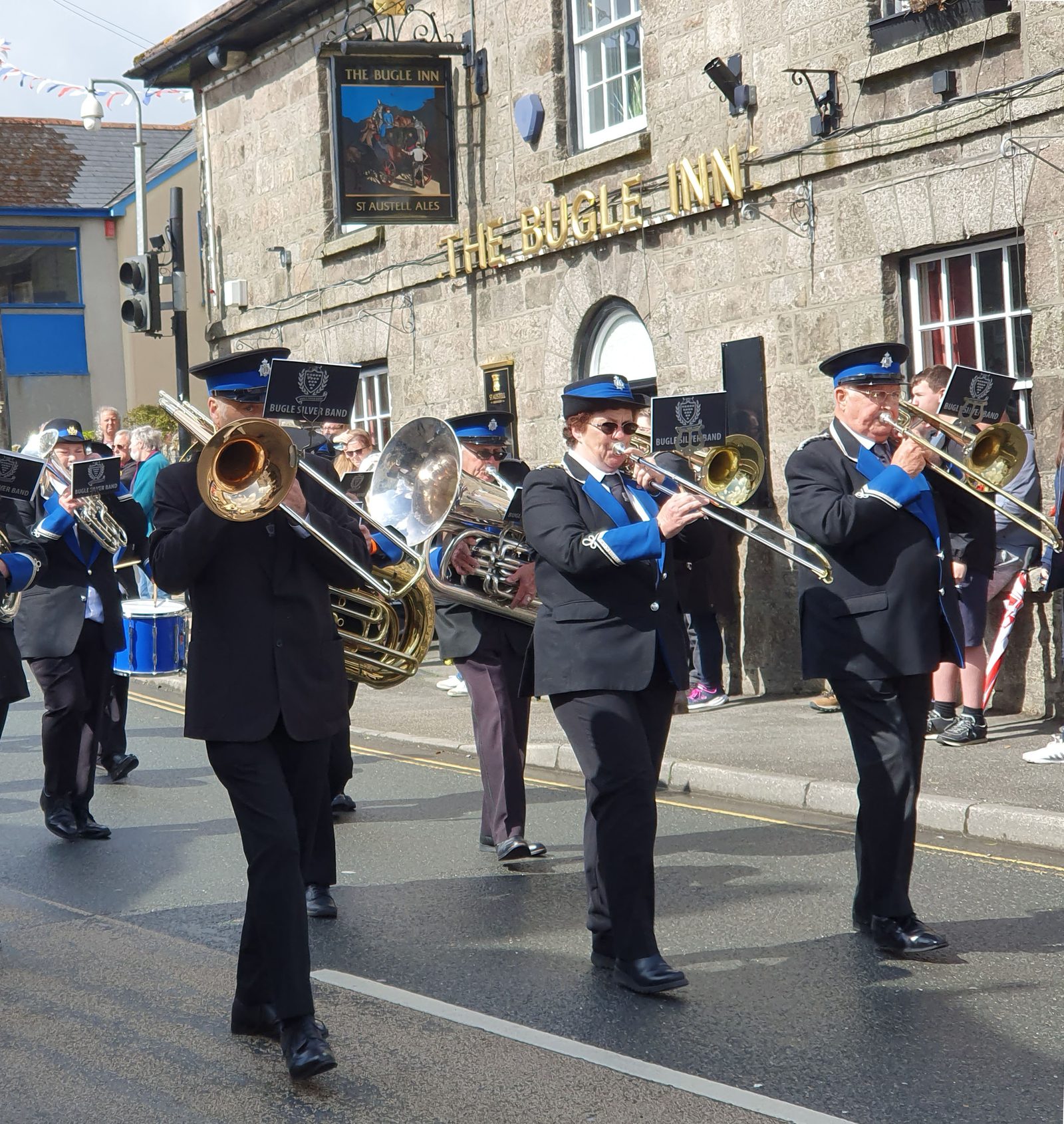 The Bugle Silver Band marching past The Bugle Inn during the band contest parade